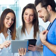 Healthcare team looking at a tablet